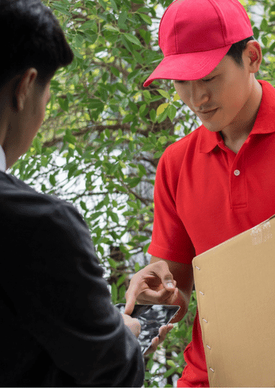 The customer is seen reaching out to receive the courier, indicating the completion of an international courier service representing the efficiency and reach of global delivery services.